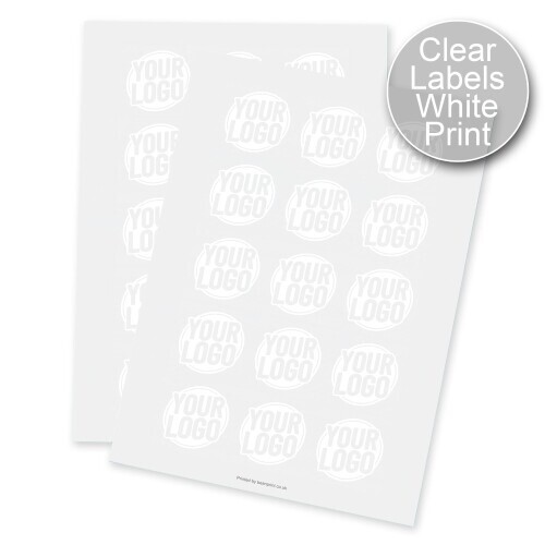 Two sheets of round transparent labels with white print, each label displaying a circular design with placeholder text. Designed for customised or personalised branding, ideal for applying logos or names to product packaging.