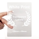 Large transparent rectangular label with white print and laurel wreath design, held between two fingers. Label measures 139mm x 99mm, perfect for customised or personalised branding on bottles, boxes or larger packaging.