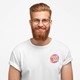 Smiling man wearing a white t-shirt with a custom logo that says Your Logo on the chest, ideal for personalised clothing or customised branding.