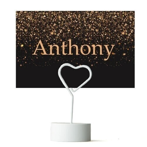personalised flat falling glitter black and gold place cards on a heart stand