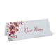 Personalised wedding place card with your name in elegant design on folded white cardstock. Minimalist design, set against a plain white background for a clean and sophisticated look.