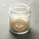 30mm circle brown kraft with white print on a cream candle with a grey background