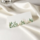 wedding place card in elegant design printed on folded white cardstock ready for you to write your names. Set on a softly draped ivory tablecloth, creating a sophisticated and timeless look.