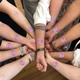 temporary tattoos on group of peoples arms