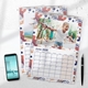 Two wall calendars with colourful coral and leaf-themed borders displayed on a white surface. The front calendar shows June 2026 with a photo of a young girl roller skating in a park. The back calendar is open to May 2026, partially visible. A smartphone and pen are placed nearby, enhancing the clean, modern setup.