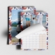 An A4 photo calendar  featuring your own photo or picture on the top page. The calendar is spiral-bound and partially open, revealing a blank month grid. Behind it, another personlaied image of your choice