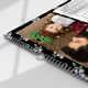 Close-up of a personalised floral calendar with wire binding and a Christmas photo of a parent and baby.