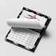 Personalised black floral photo calendar with a page turning above the monthly grid and a family picture.
