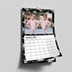 Personalised A4 black floral wall calendar displaying a January 2027 grid and a photo of two girls.