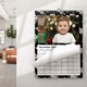 Personalised A4 November 2027 wall calendar featuring a baby by a Christmas tree and a curling page.