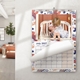 Personalised A3 wall calendar displayed in a home with a family photograph and turnable pages.