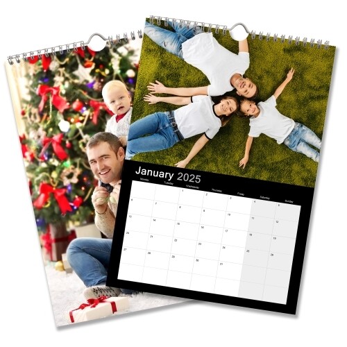 Two A3 wall calendars for 2025 with a sleek black design. One features a family lying on grass for January, and the other shows a Christmas scene with a decorated tree and presents. Both calendars have spiral bindings and hanging hooks.