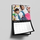 Personalised A3 August 2027 wall calendar featuring two children lying beside colourful toys.