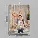 Personalised wall calendar open to January 2026, featuring a photo of a young girl playfully covering her father's eyes. Dimensions are clearly shown as 297mm high by 210mm wide.
