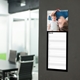 Slim black personalised photo kitchen calendar hanging on a wall with individual spaces for each day.