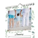 Close-up of a green leaf kitchen calendar with wire binding, a hanging hook and personalised family photo.
