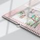 Close-up of a personalised A4 pink glitter calendar with wire binding and hanging hook