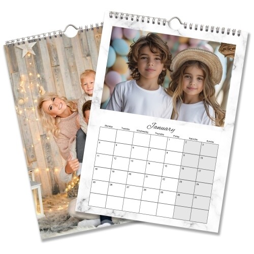 Two personalised A4 wire-bound photo calendars featuring children and a January monthly grid in a white marble design.