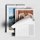 An A4 photo calendar  featuring your own photo or picture on the top page. The calendar is spiral-bound and partially open, revealing a blank month grid. Behind it, another personlaied image of your choice