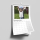 A 2025 A4 photo calendar opened to February, featuring your own photo or picture. The calendar is spiral-bound with a white hanging hook, showcasing a clean grid layout for daily notes and reminders.