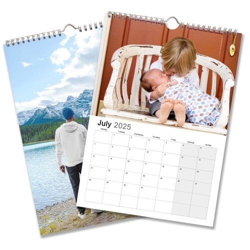 An A4 photo calendar showing January. One image features a family holding hands on a beach, and the other shows a child holding a baby. The calendar is spiral-bound with space for your images above each month.