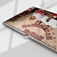 Close-up of a wire-bound personalised calendar featuring a family Christmas photograph