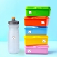 A stack of colourful lunch boxes and a water bottle, all labelled with personalised name stickers featuring a rainbow design and Your Name text, placed against a light blue background. Ideal for identifying school items like lunch boxes and bottles