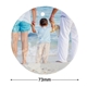 Round 73mm personalised ceramic bauble featuring a child holding hands with two adults at the beach. The child faces the ocean while one adult holds a teddy bear, creating a family moment.