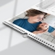 Close-up of a 2025 A4 photo calendar showing the spiral binding and hanging hook. The featured image displayed can be any photo of your choice. Part of the monthly grid is visible at the top.