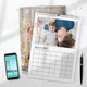 Two personalised A3 family photo calendars displayed with a curled page and monthly grids.