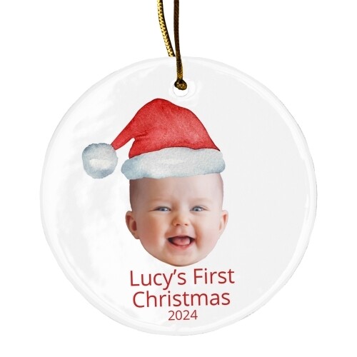 Personalised ceramic Christmas bauble featuring a baby’s smiling face wearing a festive Santa hat. Below the image, the text reads 