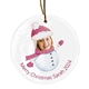 Personalised ceramic Christmas bauble featuring a woman’s smiling face on a snowman body wearing a pink hat and scarf. The text below reads 