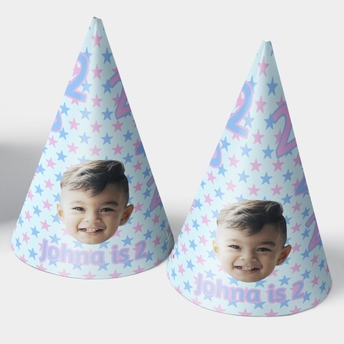 Two customised party hats with a white background, personalised with your photo and number of your choice. The hats are displayed upright side by side. Perfect for birthdays or celebrations.