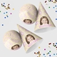 Customised party hatswith your own image and number, arranged alongside scattered colourful confetti. The hats are displayed in upright and side positions, ideal for festive celebrations.