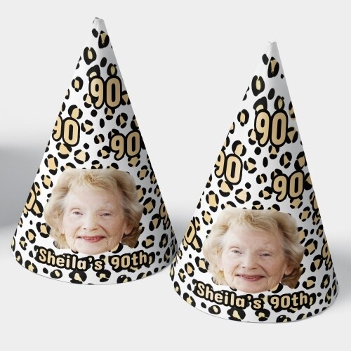 Two customised party hats with a white background, personalised with your photo and number of your choice. The hats are displayed upright side by side. Perfect for birthdays or celebrations.