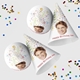 Customised party hatswith your own image and number, arranged alongside scattered colourful confetti. The hats are displayed in upright and side positions, ideal for festive celebrations.