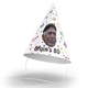 Personalised cone-shaped party hat with a colourful polka dot design, featuring the text Brain's 80 and a photo of an elderly man wearing a flat cap. The hat has an elastic chin strap and is set against a white background.