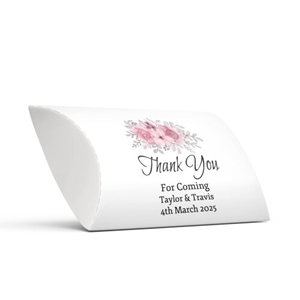 Personalised wedding favour pillow box with a white background, featuring a delicate floral design of pink roses and grey leaves. Elegant script text reads Thank You For Coming, followed by the names Taylor & Travis