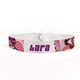 Customisable fabric wristband with a white background and bold purple text area for personalised details. Features a colourful abstract pattern on the edges and a secure fastening. Ideal for events, festivals, or branding purposes.