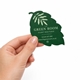 hand holding a large custom shaped cut business card