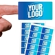 Custom 95mm x 50mm rectangle label held between fingers with printed A4 label sheets.