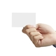 A close-up of a hand holding a blank white business card between the thumb and fingers, set against a plain white background. The card is positioned centrally, ready for customisation.