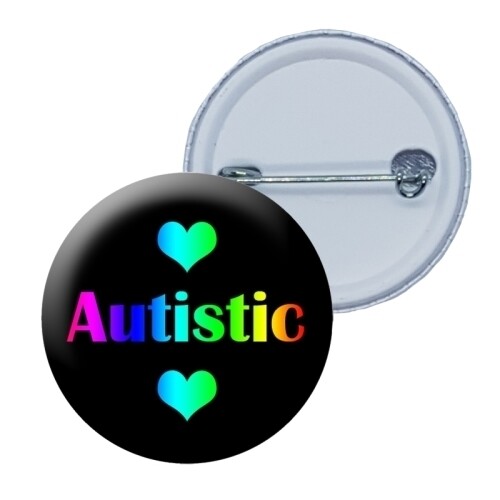 Front and back view of a round badge with a a black background featuring the word 