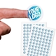 Transparent custom circle label sticker with a blue and white logo, shown on a fingertip, alongside two sheets filled with multiple identical stickers. Ideal for personalised branding or product labelling.