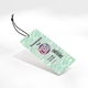 Transparnet label on a swing tag with a black string, featuring personalised branding with the text Your Logo in bold pink and white. The tag includes a barcode, product details, and pricing, ideal for customised retail labelling.