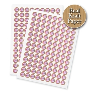 Two sheets of kraft circle label stickers with a custom pink and white logo, made from real kraft paper. The sheets display multiple eco-friendly labels, ideal for personalised branding or packaging.