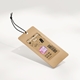 Brown kraft paper swing tag with a black string, featuring personalised branding with the text Your Logo in bold pink and white. The tag includes a barcode, product details, and pricing, ideal for customised retail labelling.