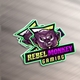 A stack of vibrant Rebel Monkey Gaming vinyl stickers featuring an aggressive purple monkey face with bold neon green, yellow, and purple accents. The design is placed on a metallic surface, with the text in a striking