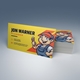 a business card for a plumber leant againt a stack of cards