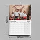 A 2025 A3 photo calendar measuring 297mm by 210mm. The displayed month is January, featuring a family standing on the beach, holding a child's hands. The calendar is spiral-bound with a hanging hook and has a spacious monthly grid for notes and events.